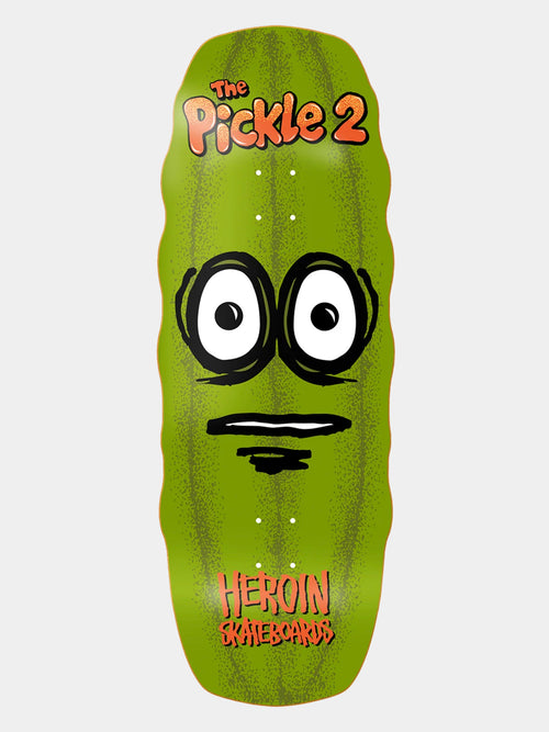 Heroin skateboard deck 'THE PICKLE 2' in orange written on giant green pickle graphic with large, white eyes. 'HEROIN Skateboards' branding in orange.