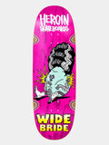 A skateboard deck featuring a bright pink background with a cartoon graphic of a stitched zombie-like figure with a large black afro, and bold text reading 'HEROIN SKATEBOARDS' at the top and 'WIDE BRIDE' at the bottom.