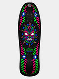 Powell Peralta Nicky Guerrero Mask Backlight Skateboard Deck Reissue. Bottom graphic shows Sean Cliver tribal mask artwork in neon fluorescent ink on an asymmetrical 10 inch 1989 shape. 'NICKY GUERRERO' branding in neon green.