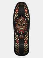 A Nicky Guerrero full-size skateboard deck featuring a black background with a central red and gold tribal mask graphic, surrounded by gold geometric patterns and red accents.