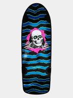 A Powell Peralta skateboard deck featuring a black background with blue and green wavy stripes, a pink torn-paper effect, and a white skull graphic with green eyes.
