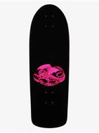 A black skateboard deck featuring a vibrant pink graphic of a dragon wrapped in a banner that reads 'QUELLA PESS' on a light gray background.