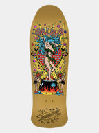 A gold-colored skateboard deck featuring a colorful graphic illustration of a woman with blue hair standing in front of a red heart and cauldron, with the brand name 'SNAEBE' printed at the top and 'SNAEBE' stylized at the bottom.
