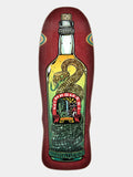 A skateboard deck featuring a detailed graphic of a bottle with a coiled green and gold snake, set against a dark red wood-grain background, on a light gray studio background.