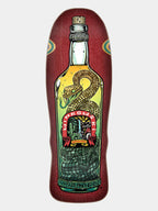 A skateboard deck featuring a detailed graphic of a bottle with a coiled green and gold snake, set against a dark red wood-grain background, on a light gray studio background.