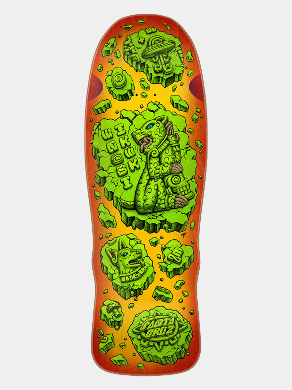 A Santa Cruz skateboard deck featuring a vibrant graphic design with green alien-like creatures and floating rocks on a bright yellow and orange gradient background, shown against a light gray studio backdrop.
