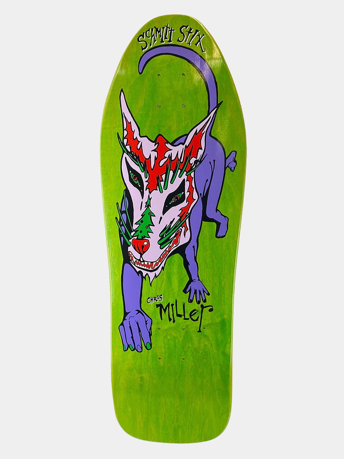 A green skateboard deck featuring a stylized purple cat with red and green face paint, with the text 'Spirit Stick' and 'Chris Miller' printed on the deck.